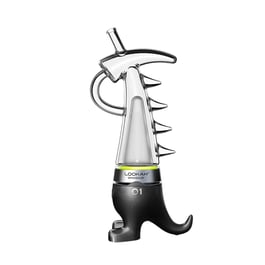 Lookah Dinosaur electronic dab rig displayed next to its packaging, featuring a distinctive dinosaur-inspired design with a purple base resembling dinosaur feet, clear glass body, spiked detailing, and a curved mouthpiece.
